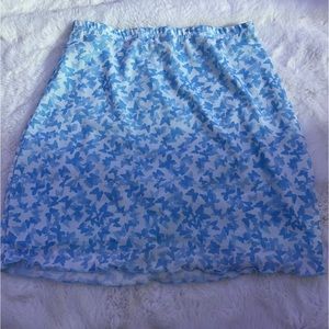 light blue skirt, stretchy, pretty tight, white and blue butterflies